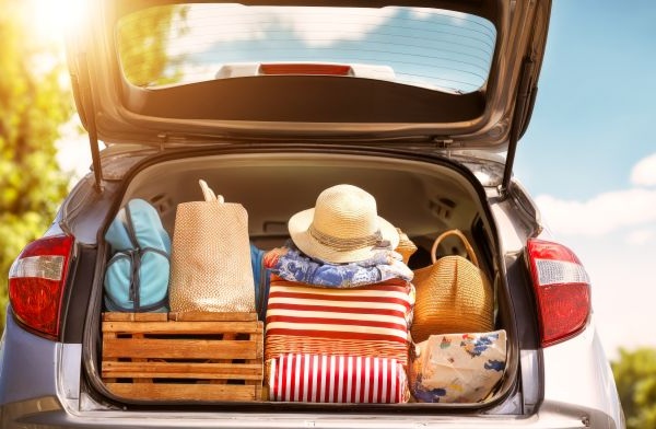 back of car packed for a summer trip