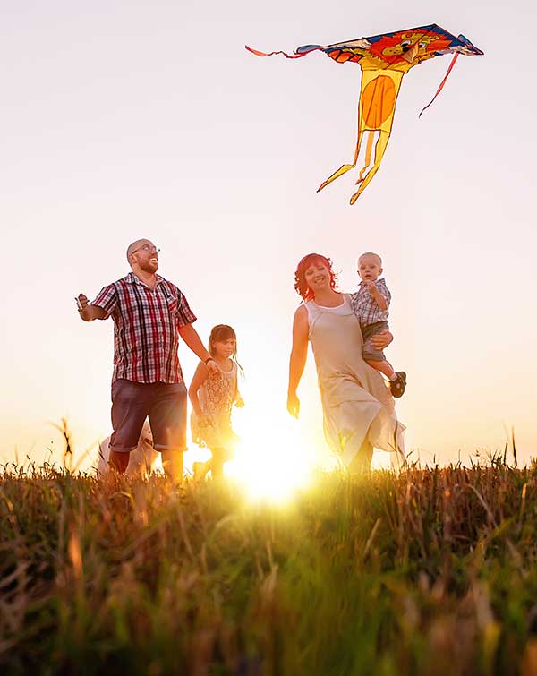 Family with kite outside